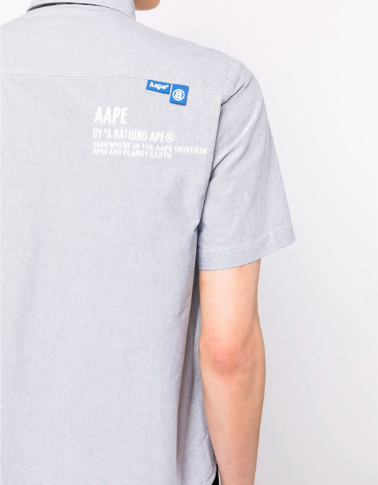 AAPE BY *A
BATHING APE®️
Camouflage-print logo- patch shirt